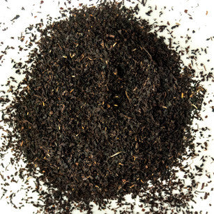 Australian Premium Black - Blue Mountains Tea Co, the Tea Leaves are scattered to show the cut of the tea, this tea is grown in Australia in the northern regions.
