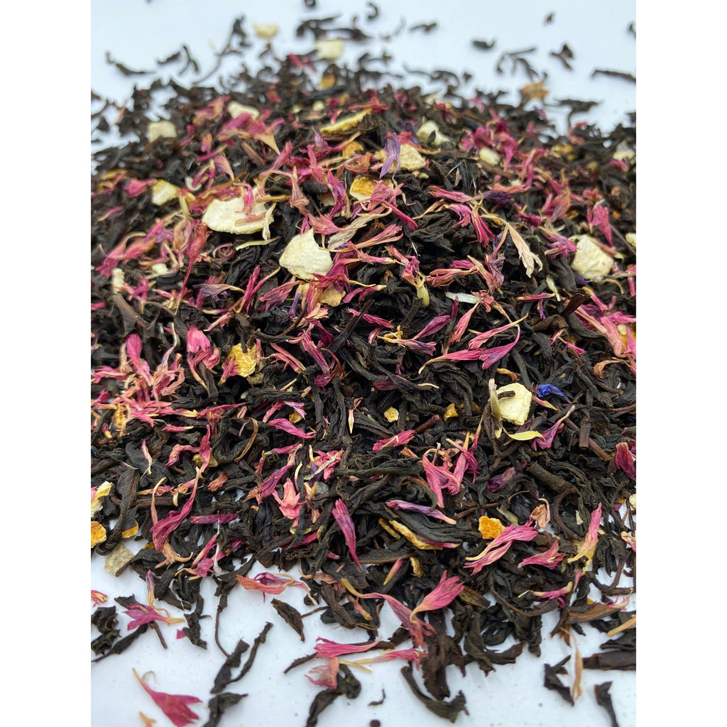 Close up of Leura Countess Grey Tea leaves are scattered to show the cut of the tea and to define the beautiful ingredients within. All crafted for delicious flavours by Blue Mountains Tea Co.