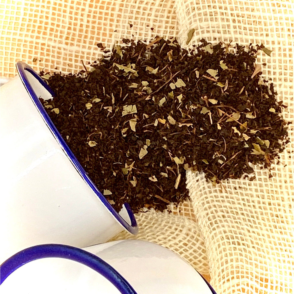 Real Aussie Campfire Tea, Australian Made with Australian Ingredients. Here the tea leaves are scattered to show the Lemon Myrtle and Eucalyptus leaves within.